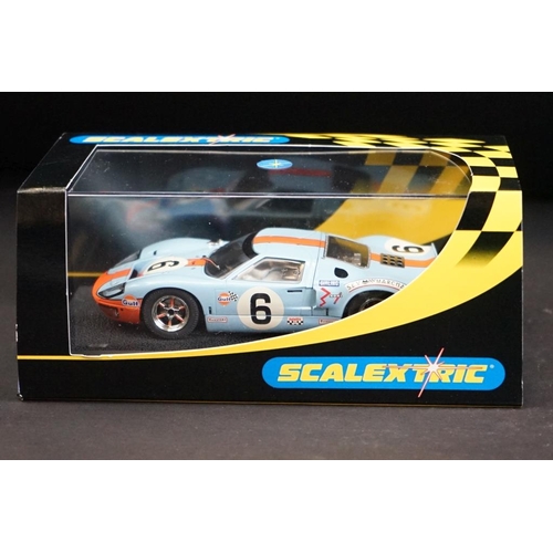 287 - Three cased Scalextric slot cars to include C2403 Ford GT 40 1968 No 9, C2404 Ford GT40 1969 No 6, C... 