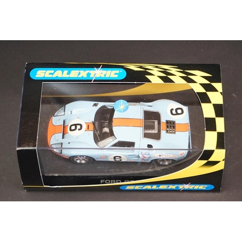 287 - Three cased Scalextric slot cars to include C2403 Ford GT 40 1968 No 9, C2404 Ford GT40 1969 No 6, C... 