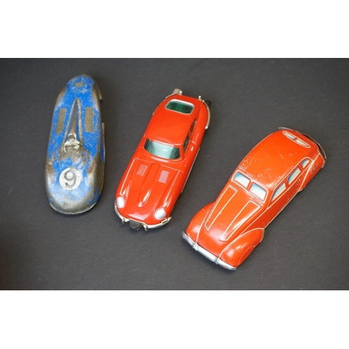 1265 - Eight mid 20th C tin plate models to include Schuco Micro Racer 1047 Jaguar in red with key, Schuco ... 