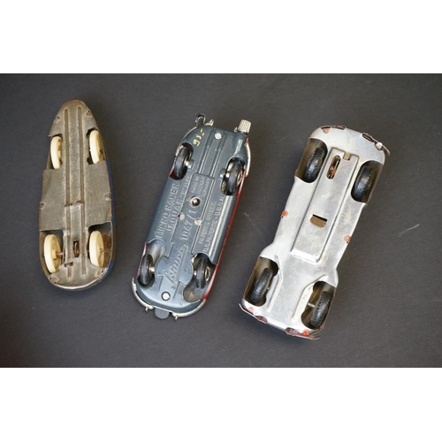 1265 - Eight mid 20th C tin plate models to include Schuco Micro Racer 1047 Jaguar in red with key, Schuco ... 