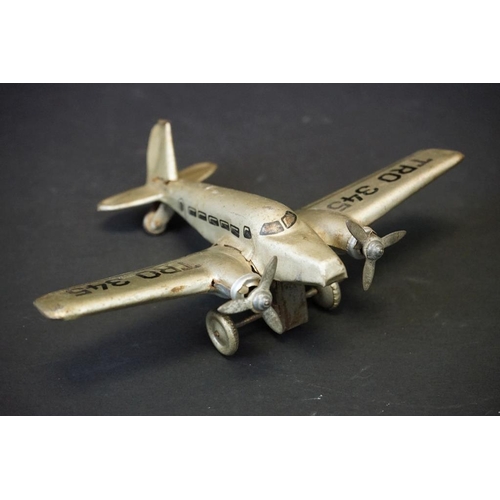 1266 - Six tin plate & plastic models to include 1930/40s Hammerer & Kuhlwein TRO345 plane, Japanese batter... 