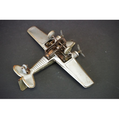 1266 - Six tin plate & plastic models to include 1930/40s Hammerer & Kuhlwein TRO345 plane, Japanese batter... 