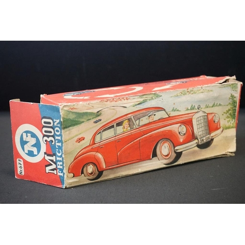 1254A - Two boxed tin plate models to include JNF M300 Nr 67F Friction Mercedes in cream and Arnold Mercedes... 