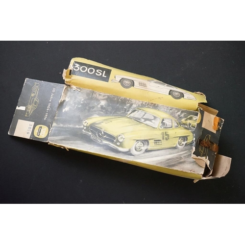 1254A - Two boxed tin plate models to include JNF M300 Nr 67F Friction Mercedes in cream and Arnold Mercedes... 