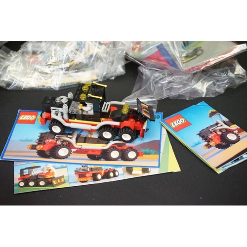 187 - Lego - 21 Lego vehicles, circa 1990's, to include 6526 Red Line Racer, 6509 Red Devil Racer, 1731 Ic... 