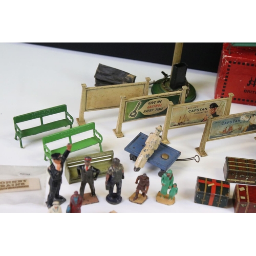 132 - Large group of O gauge station & trackside accessories containing many scare items to include 7 x ti... 