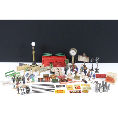 132 - Large group of O gauge station & trackside accessories containing many scare items to include 7 x ti... 