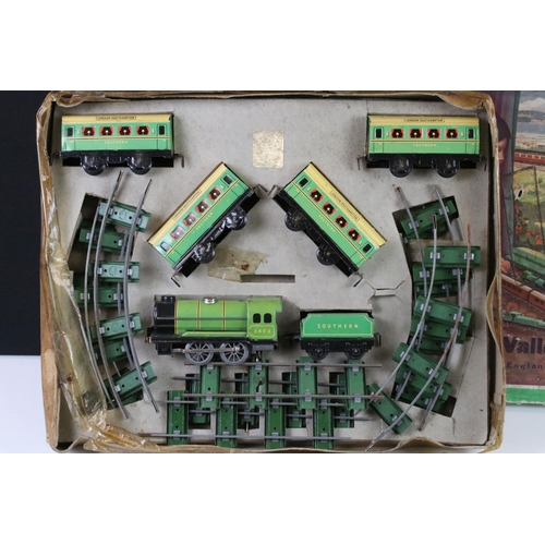 140 - Two early-mid 20th C boxed tin plate train sets to include Brimtoy Clockwork Train No 37/0 Colour GN... 