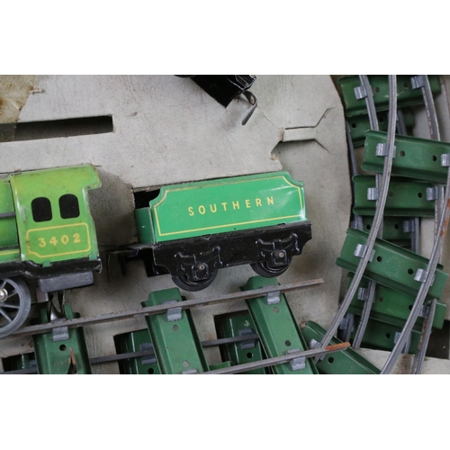 140 - Two early-mid 20th C boxed tin plate train sets to include Brimtoy Clockwork Train No 37/0 Colour GN... 