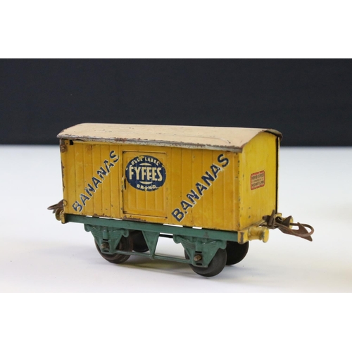 143 - 12 Hornby O gauge play worn items of rolling stock to include Cadbury's Chocolates, Fyffes Bananas, ... 