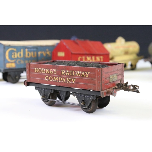 143 - 12 Hornby O gauge play worn items of rolling stock to include Cadbury's Chocolates, Fyffes Bananas, ... 