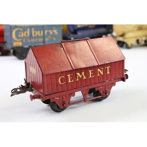 143 - 12 Hornby O gauge play worn items of rolling stock to include Cadbury's Chocolates, Fyffes Bananas, ... 