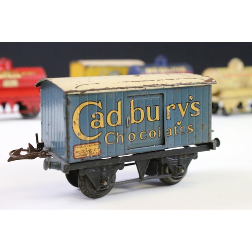 143 - 12 Hornby O gauge play worn items of rolling stock to include Cadbury's Chocolates, Fyffes Bananas, ... 