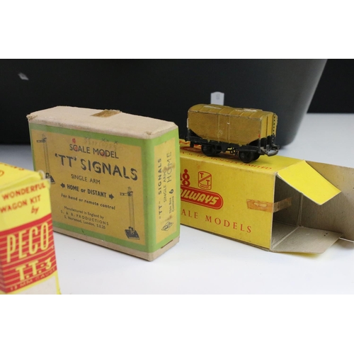 160 - Around 68 boxed Triang TT gauge items of rolling stock to include wagons, coaches and vans, features... 