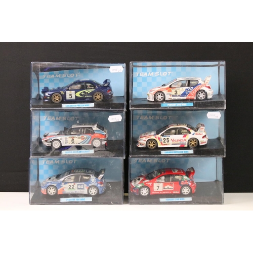 297 - Six cased 'Team Slot' slot cars to include 10604 Subaru Imprezza WRC 