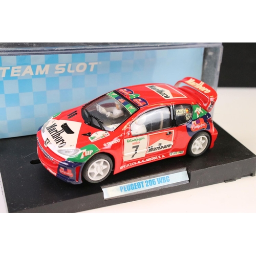 297 - Six cased 'Team Slot' slot cars to include 10604 Subaru Imprezza WRC 