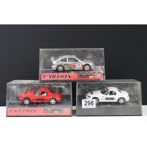 298 - Three cased Cartrix slot cars to include a BMW Z3, 0302-E Hyundai Accent WRC Catalunya 2000 and a 01... 