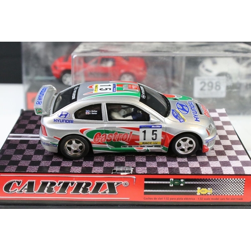 298 - Three cased Cartrix slot cars to include a BMW Z3, 0302-E Hyundai Accent WRC Catalunya 2000 and a 01... 