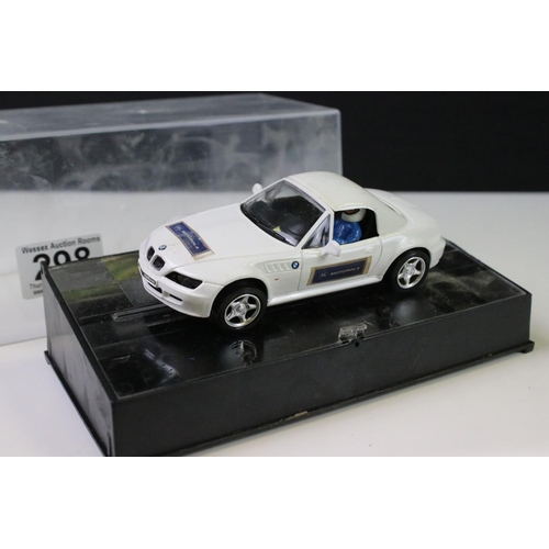 298 - Three cased Cartrix slot cars to include a BMW Z3, 0302-E Hyundai Accent WRC Catalunya 2000 and a 01... 