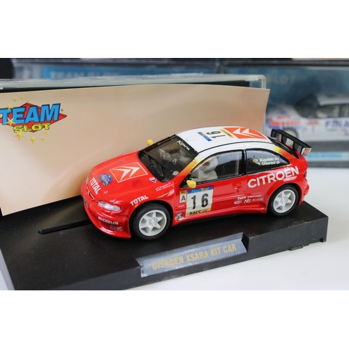 299 - Five cased 'Team Slot' slot cars to include 11001 Peugeot 206 WRC 