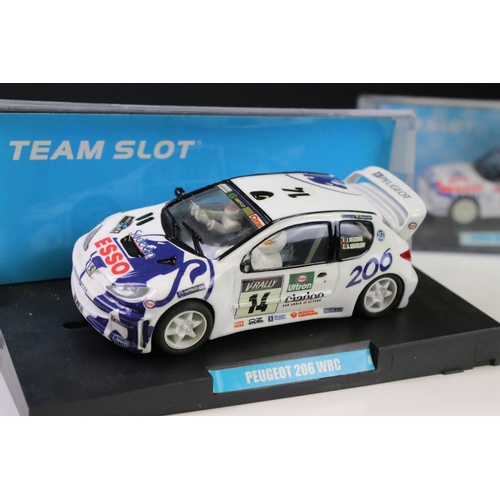 299 - Five cased 'Team Slot' slot cars to include 11001 Peugeot 206 WRC 