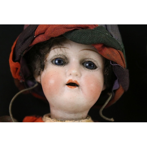 409 - Armand Marseille Bisque Head Doll, impressed mark A 5/0 M, 30cm long together with another small Bis... 