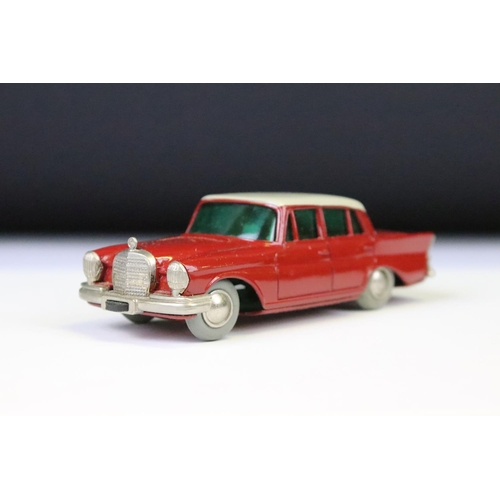 1365 - Boxed clockwork Schuco 1038 Mercedes 220S Micro Racer diecast model in red with white roof, with key... 