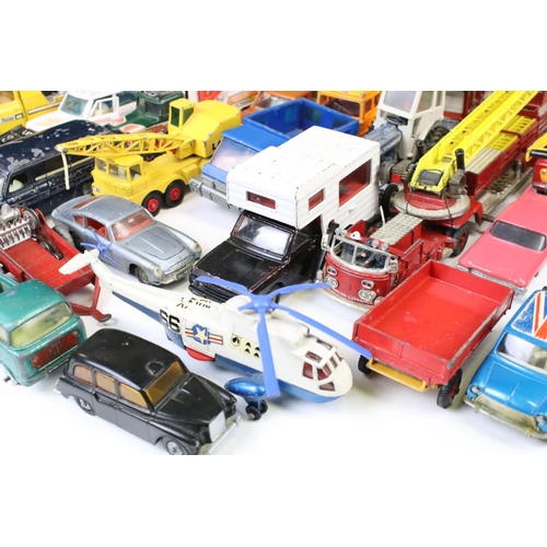 1309 - Around 35 play worn diecast models, mainly mid 20th C, to include Dinky, Corgi, Matchbox, Britains &... 