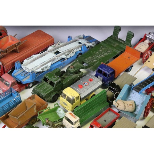 1312 - Around 35 mid 20th C play worn diecast & tinplate models to include Dinky, Corgi, Triang Spot-On and... 