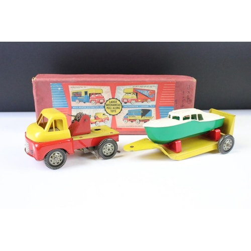 1350 - Two boxed Wells Brimtoy Large Mechanical Pull Along Toys tin plate models to include 707 Boat Carrie... 