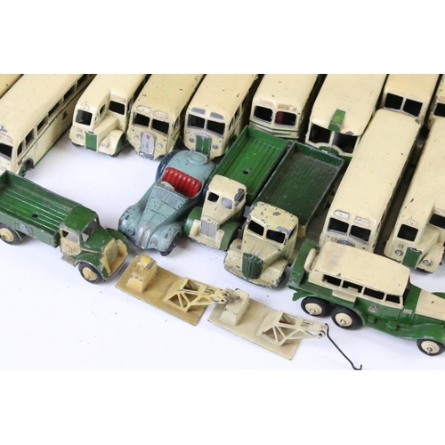 1352 - Around 60 early-mid 20th C play worn Dinky diecast models mainly featuring buses and public transpor... 