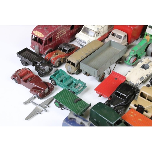 1293 - Around 45 mid 20th C. play worn Dinky diecast models to include a 162 Ford Zephyr, 157 Jaguar, Ford ... 