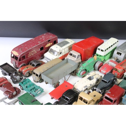 1293 - Around 45 mid 20th C. play worn Dinky diecast models to include a 162 Ford Zephyr, 157 Jaguar, Ford ... 