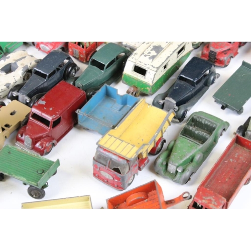 1293 - Around 45 mid 20th C. play worn Dinky diecast models to include a 162 Ford Zephyr, 157 Jaguar, Ford ... 