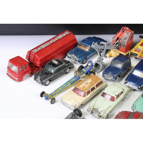 1300 - Around 27 mid 20th C. play worn Corgi diecast models to include a Hillman Imp, Bentley Continental, ... 