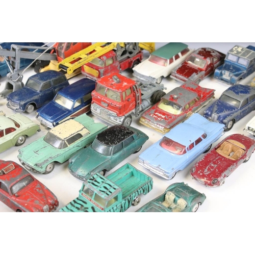 1300 - Around 27 mid 20th C. play worn Corgi diecast models to include a Hillman Imp, Bentley Continental, ... 