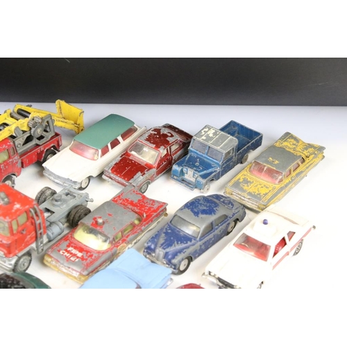 1300 - Around 27 mid 20th C. play worn Corgi diecast models to include a Hillman Imp, Bentley Continental, ... 