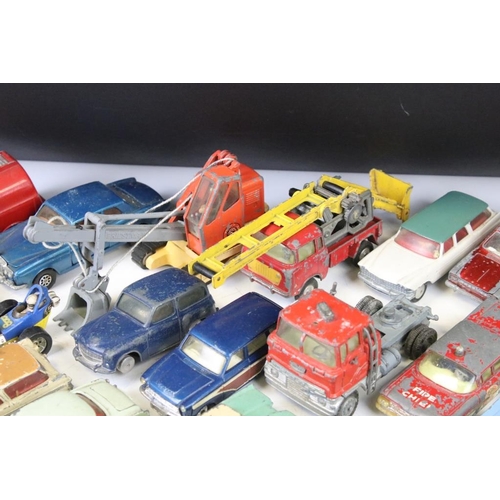 1300 - Around 27 mid 20th C. play worn Corgi diecast models to include a Hillman Imp, Bentley Continental, ... 