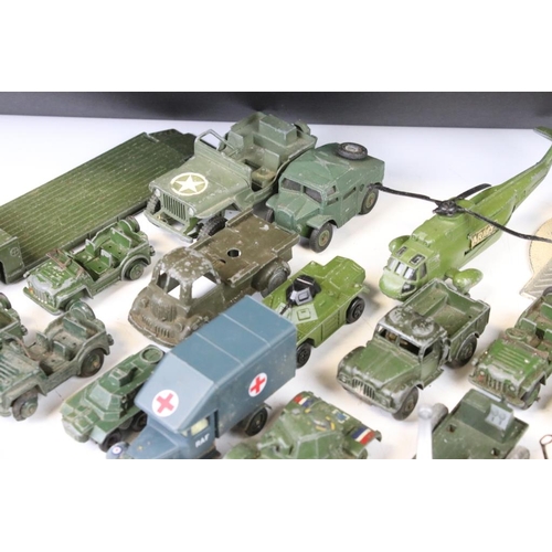 1301 - Around 27 mid 20th C. play worn military diecast models, to include Corgi, Dinky, Matchbox, Lone Sta... 