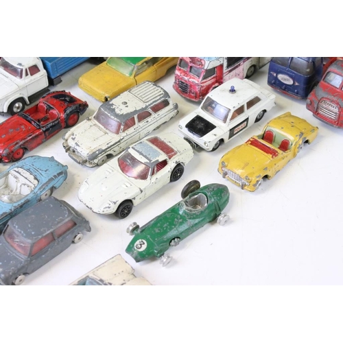 1318 - Around 75 mostly mid 20th C play worn diecast, tin plate & plastic models, to include Dinky, Triang ... 