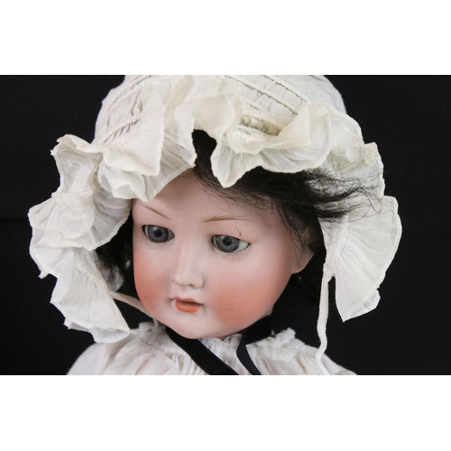 421 - Two Early 20th century Bisque Head Dolls including Revalo Doll with impressed marks 7, 54cm long and... 