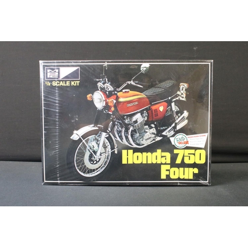 371 - Three boxed sealed plastic model kits to include MPC827/12 1:8 scale Honda 750 Four, Heller 1:24 Jag... 