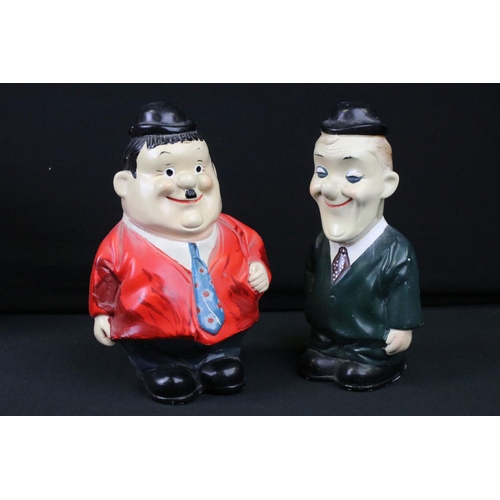 424 - 12 Tin plate, plastic, moulded and soft toys to include Laurel & Hardy money boxes, 4 x tin plate cl... 