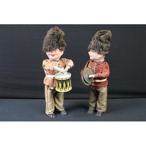 425 - Mid 20th C West German tinplate drummer boy and cymbalist, with keys (approx 27cm high); plus a 1950... 