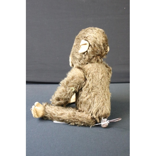 429 - Mid 20th C straw-filled mechanical monkey, jointed, approx 34cm high