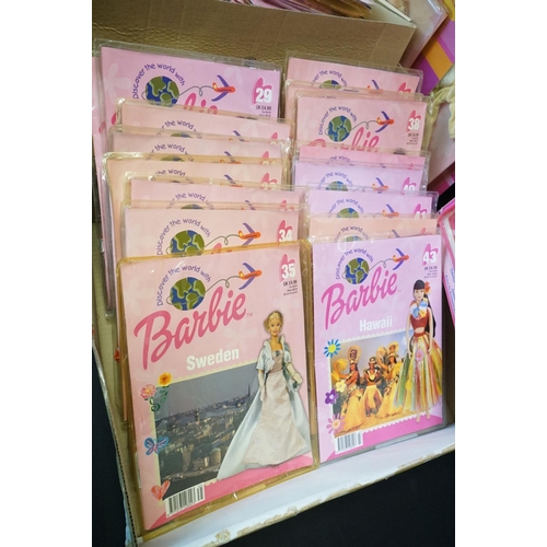 442 - 42 Barbie Discover the World with Barbie magazines with clothing, plus a boxed Barbie Accessory Shou... 