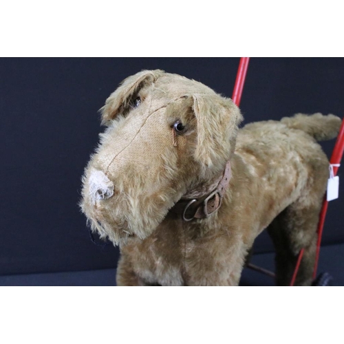 377 - Mid 20th C Triang straw-filled mohair push-along dog toy; together with a Triang Minic wooden car ga... 