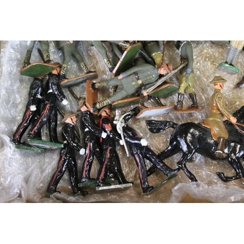 324 - Over 125 assorted metal soldier figures, mostly recasts of Britains, featuring Alan Goodwin figures.... 