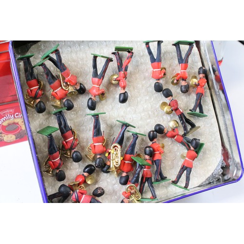 311 - Around 300 Britains Scots Guards plastic figures to include marching bandsmen, plus a small quantity... 