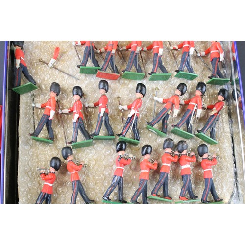 311 - Around 300 Britains Scots Guards plastic figures to include marching bandsmen, plus a small quantity... 